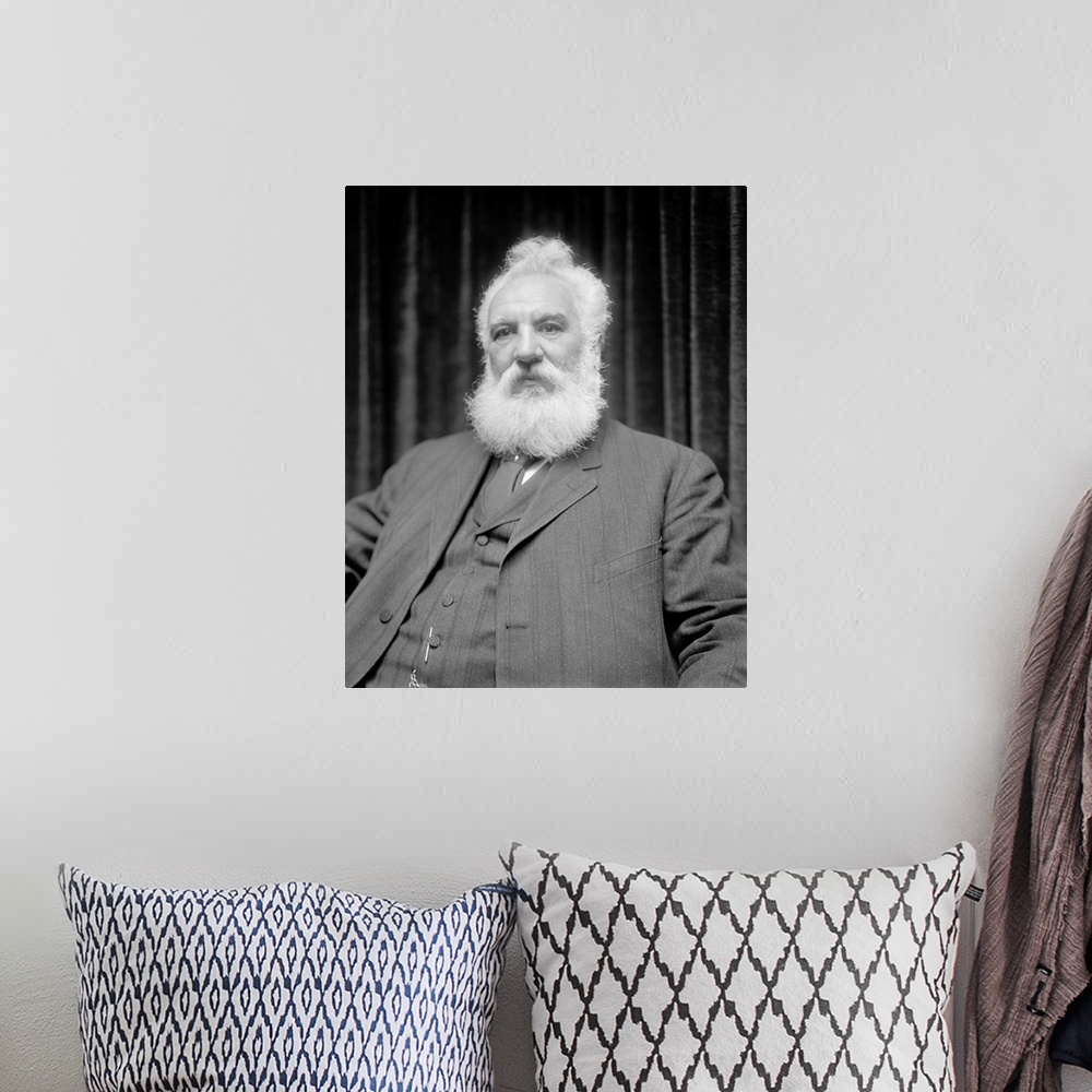 A bohemian room featuring American history portrait of Alexander Graham Bell.