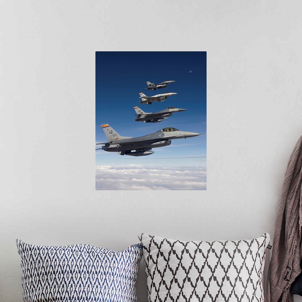 A bohemian room featuring Four F-16's stationed at the 162nd Fighter Wing in Tucson, Arizona, fly in formation during a tra...