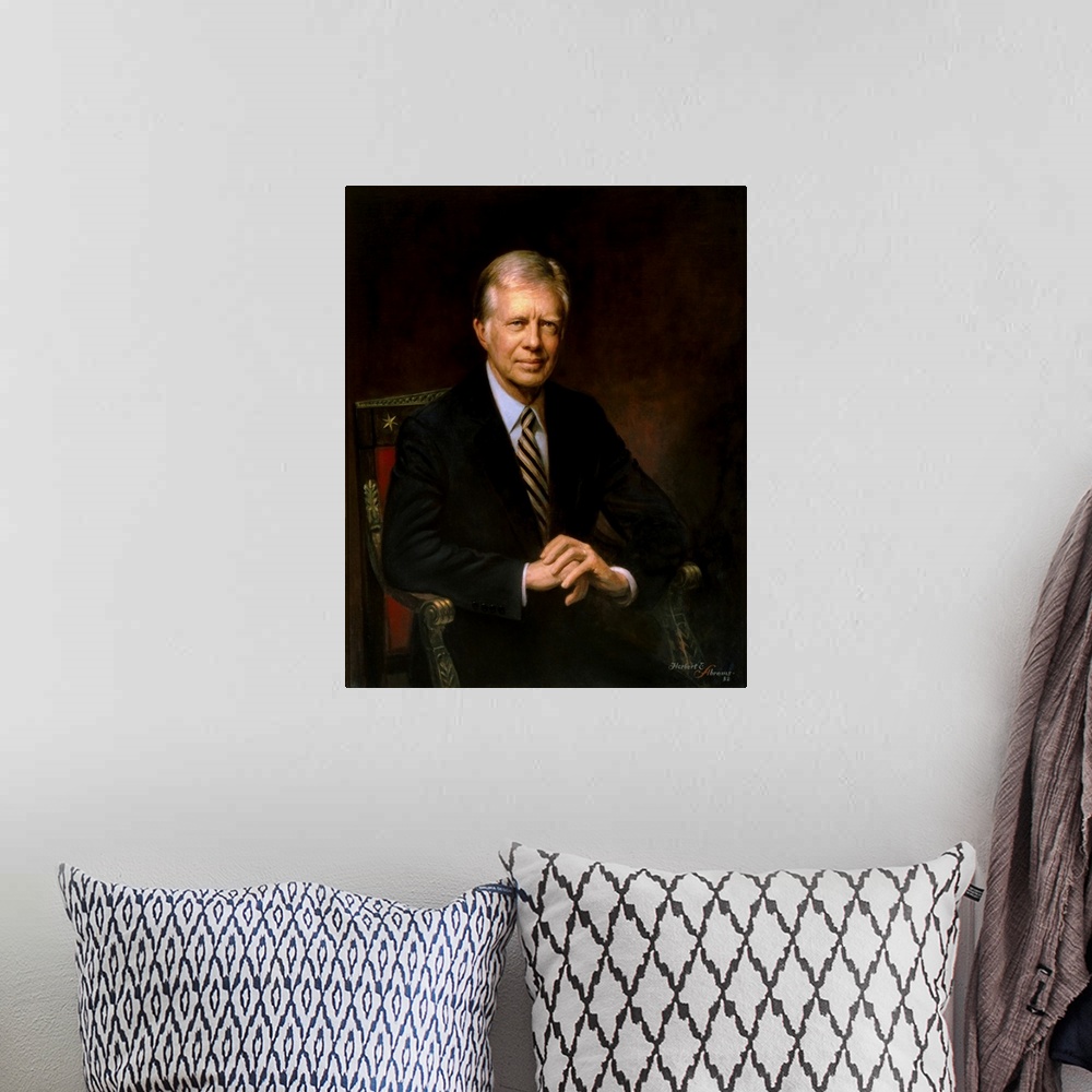 A bohemian room featuring Presidential portrait of Jimmy Carter.