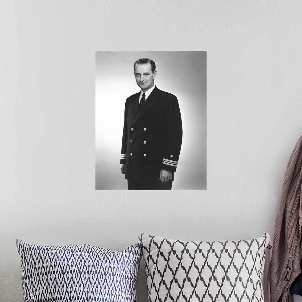 A bohemian room featuring World War II portrait of a young Lyndon Johnson in his naval uniform.