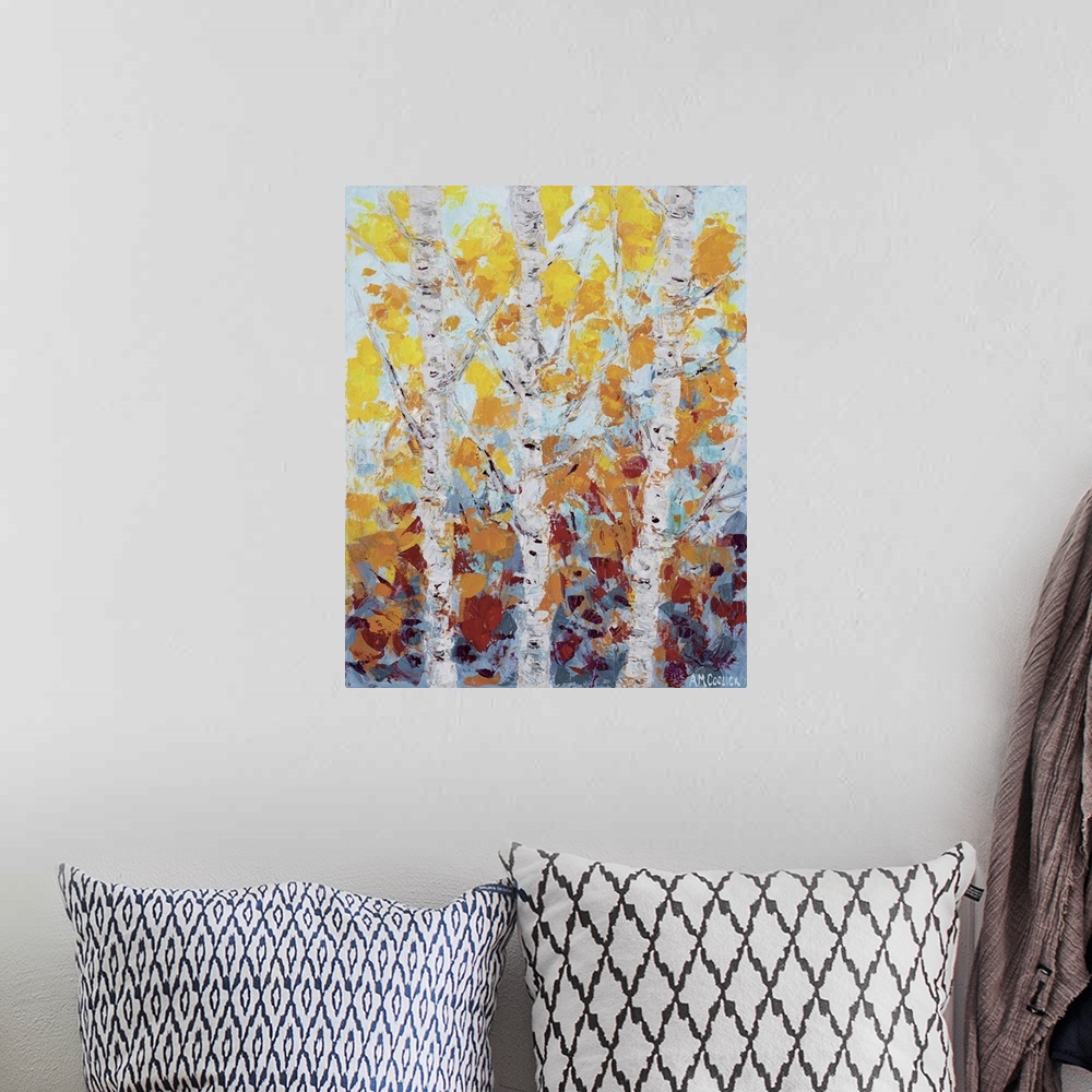 A bohemian room featuring Three white aspen trees with fall leaves.