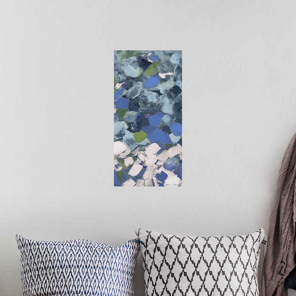 A bohemian room featuring Abstract art with blue and white spots.