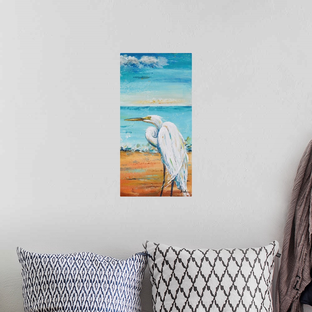A bohemian room featuring Contemporary painting of a white egret standing on a sand beach with the ocean in the background.