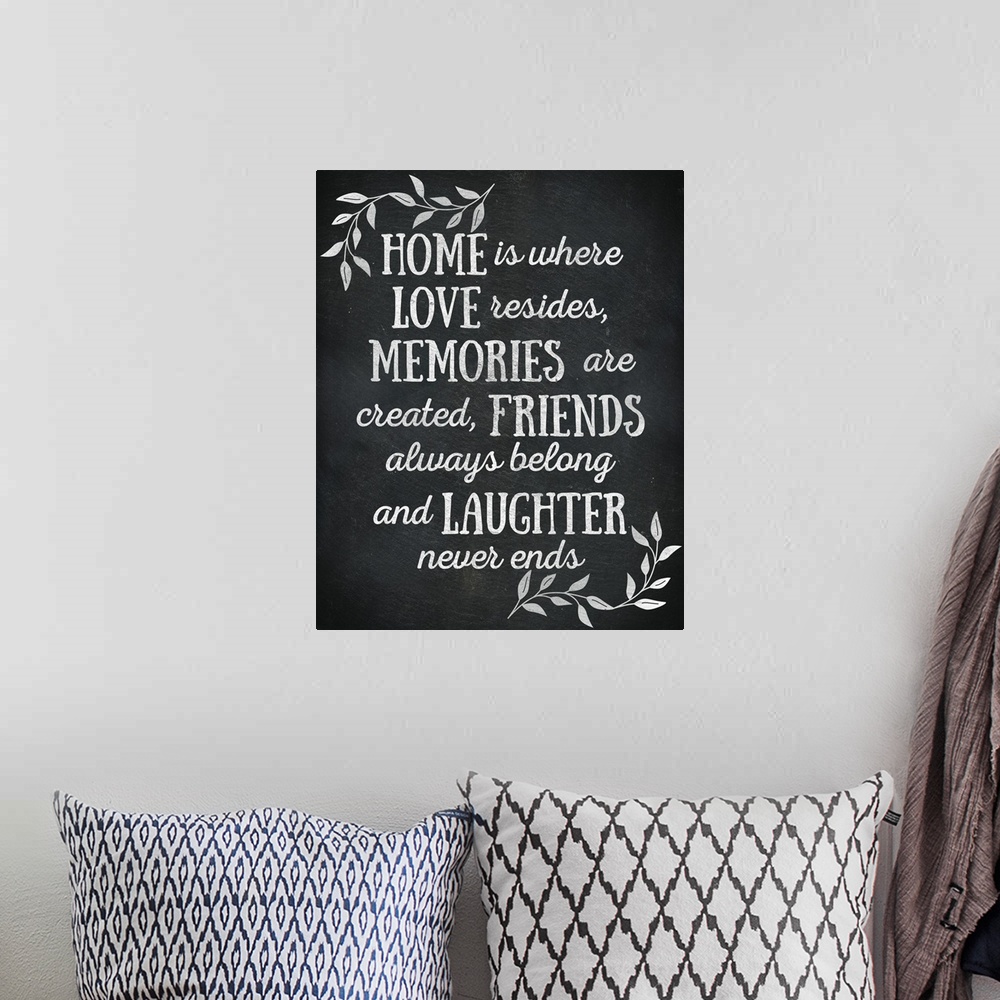 A bohemian room featuring Chalkboard sign that reads "Home is where Love resides, Memories are created, Friends always belo...