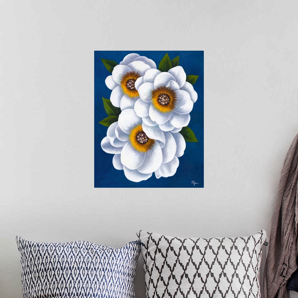 A bohemian room featuring Contemporary painting of three beautiful white flowers on a bright blue background.