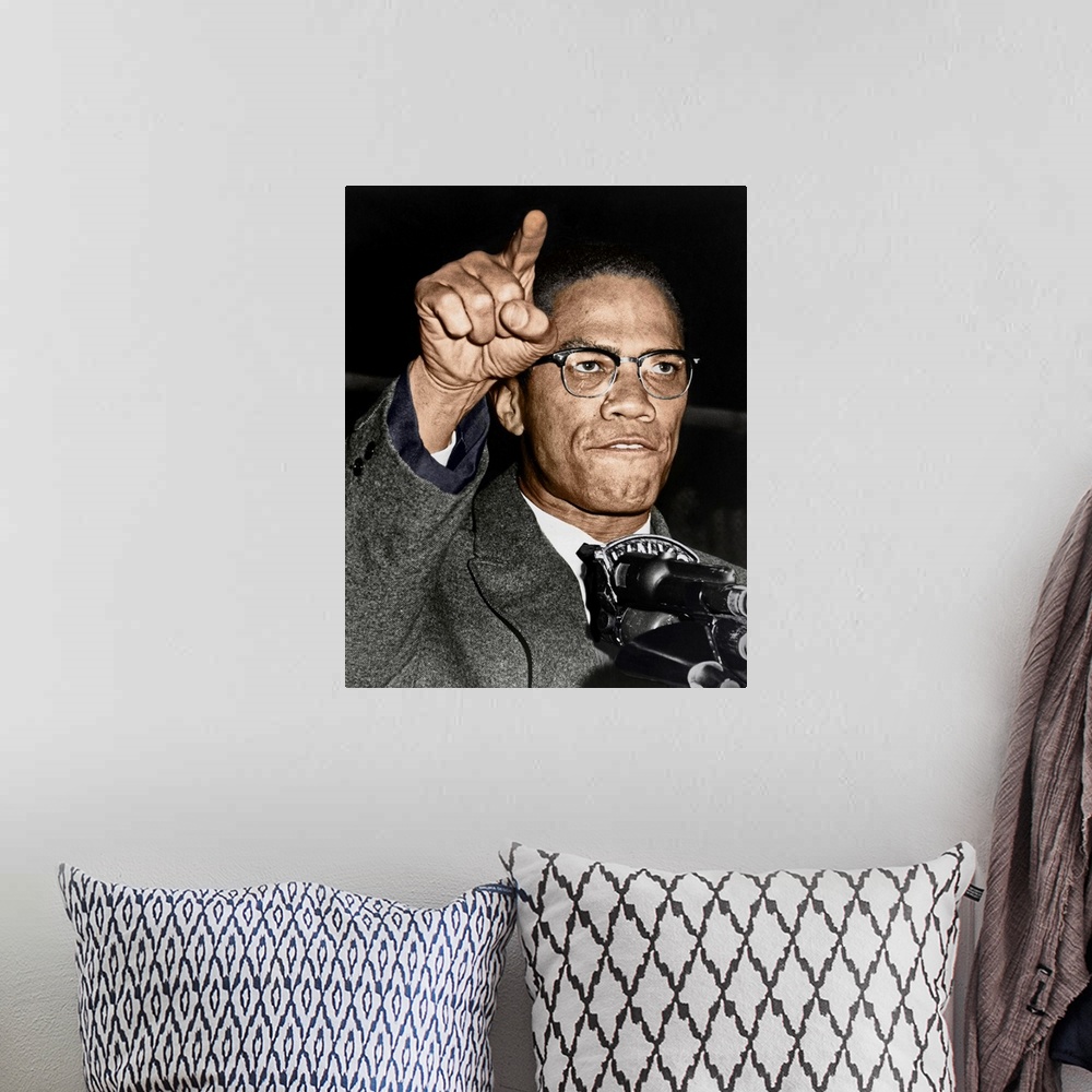 A bohemian room featuring MALCOLM X (1925-1965). Born Malcolm Little. American religious and political leader. Photographed...