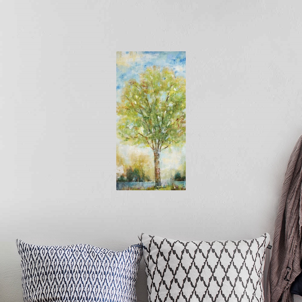 A bohemian room featuring Contemporary painting of a tree with bright green foliage.