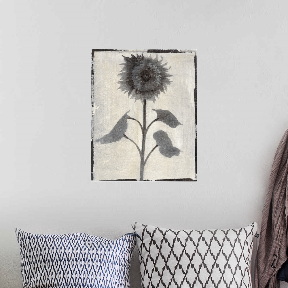 A bohemian room featuring Vertical contemporary painting of flowers in faded shades of grey with a rough, simple black border.