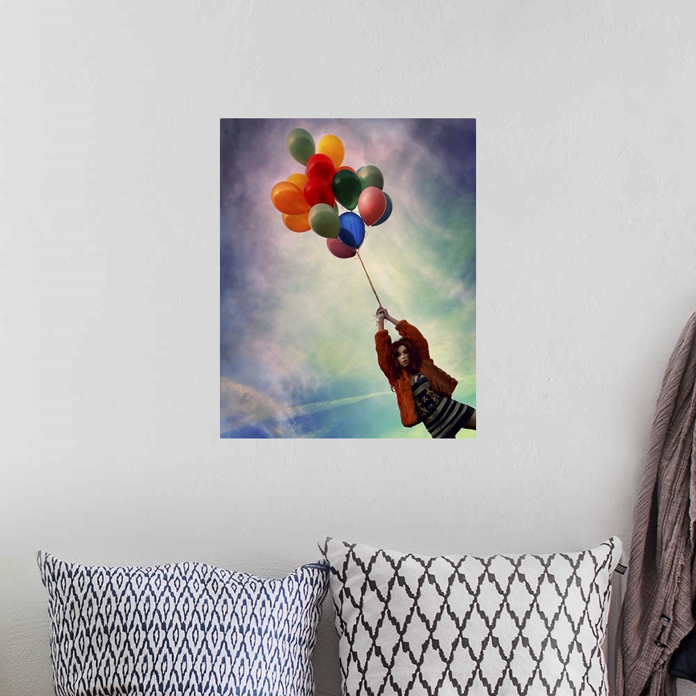 A bohemian room featuring A young woman holding balloons