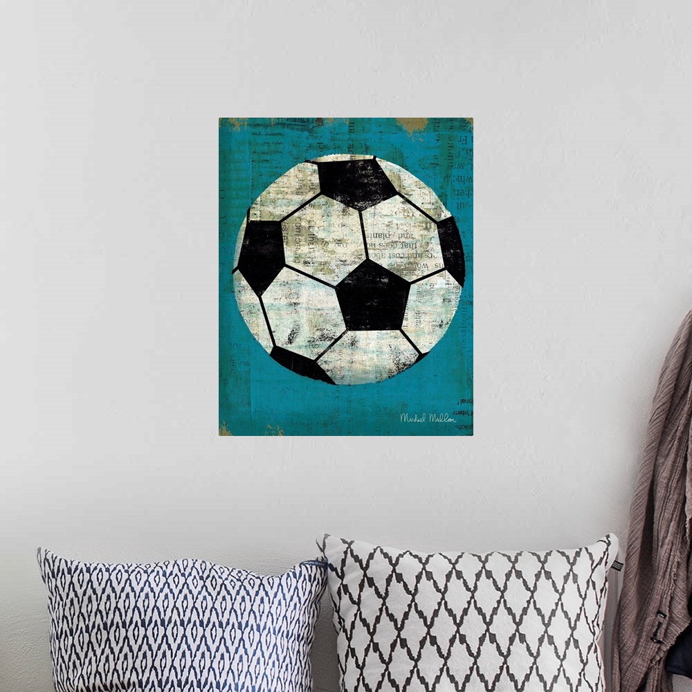 A bohemian room featuring Contemporary artwork of a soccer ball against a weathered blue background.
