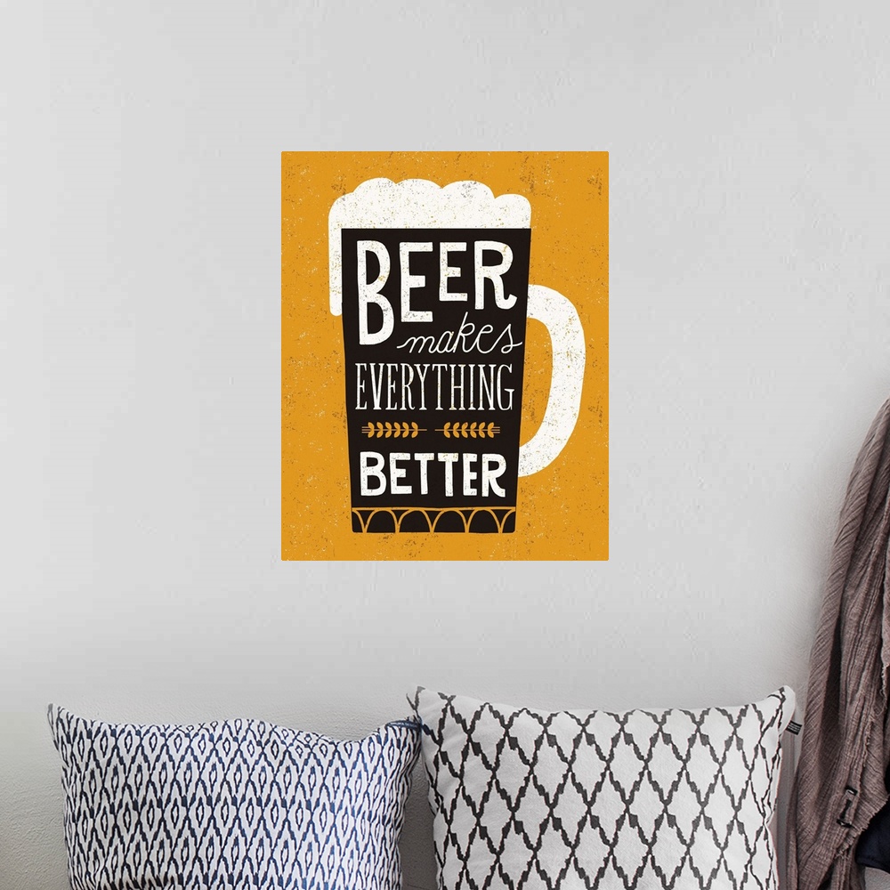 A bohemian room featuring Fun typography artwork in the shape of a beer mug.