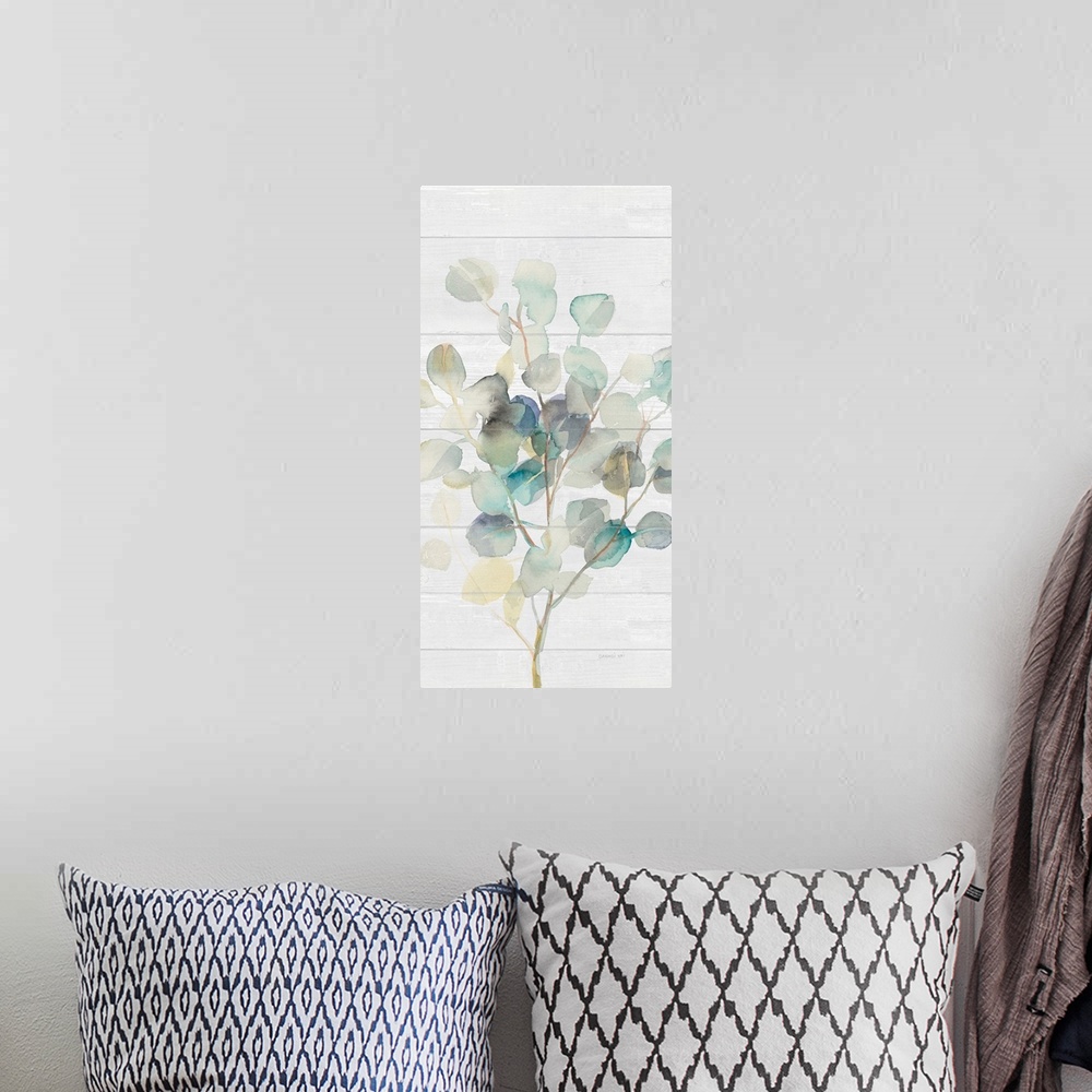 A bohemian room featuring Decorative artwork of watercolor eucalyptus leaves over a shiplap.