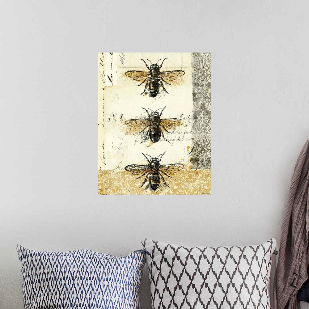 A bohemian room featuring Contemporary artwork of three insects lined from top to bottom, on golden and weathered looking b...