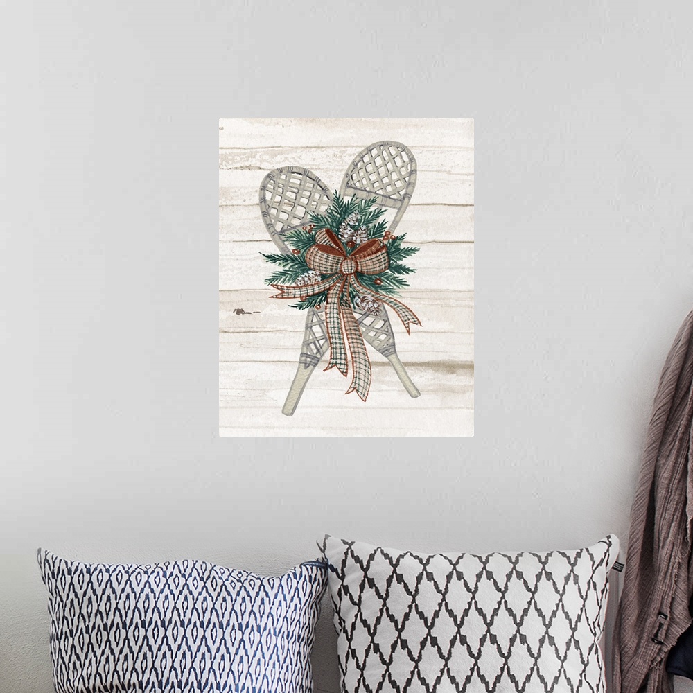 A bohemian room featuring Holiday wreath with snowshoes on a off white planked wall.