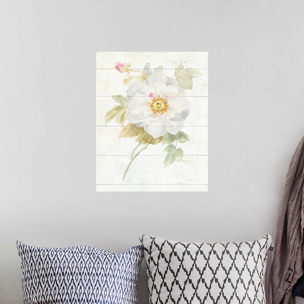 A bohemian room featuring Contemporary artwork of a white blooming rose on a cream colored wood background.