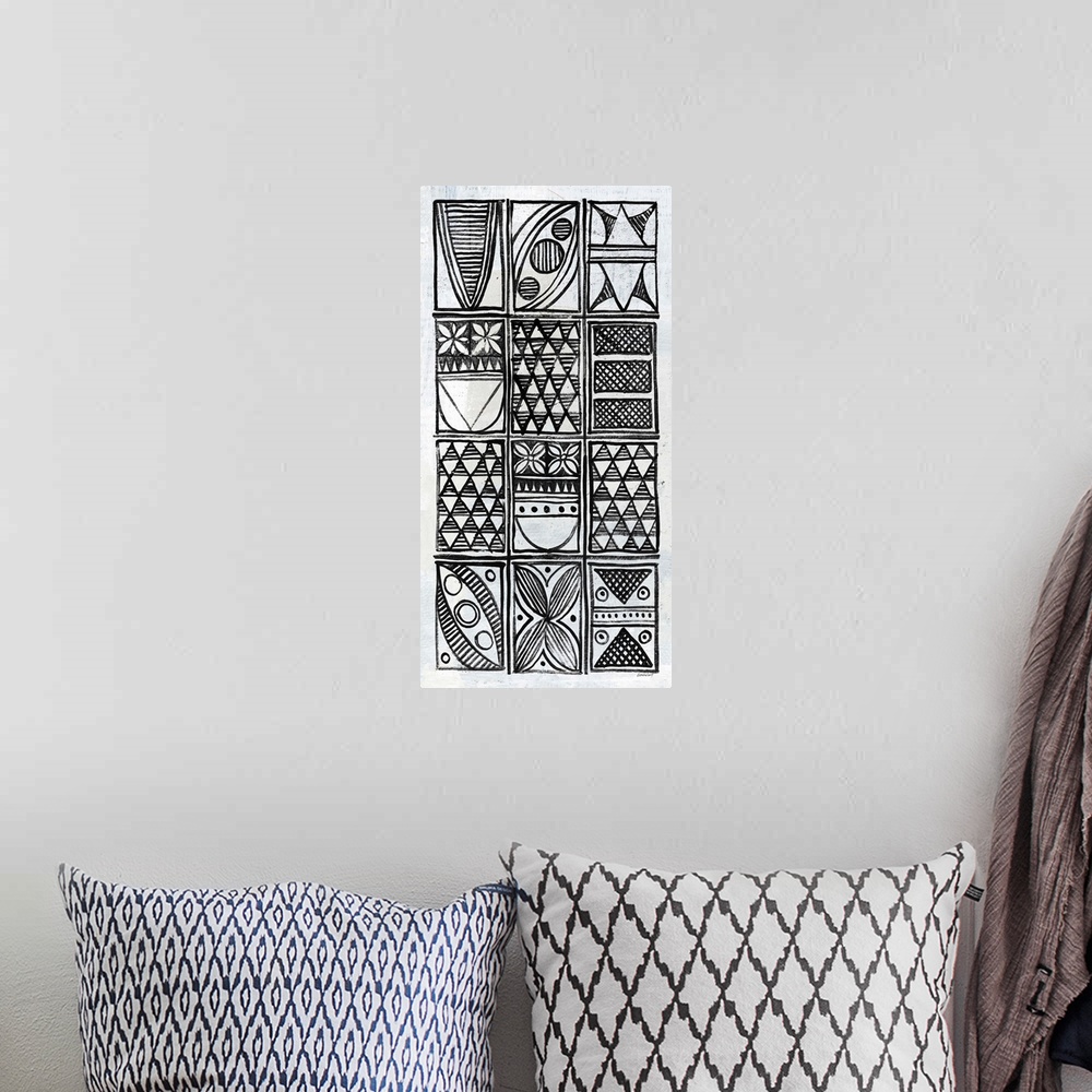 A bohemian room featuring Black and white painting with neatly stacked rectangles filled with  different intricate designs.