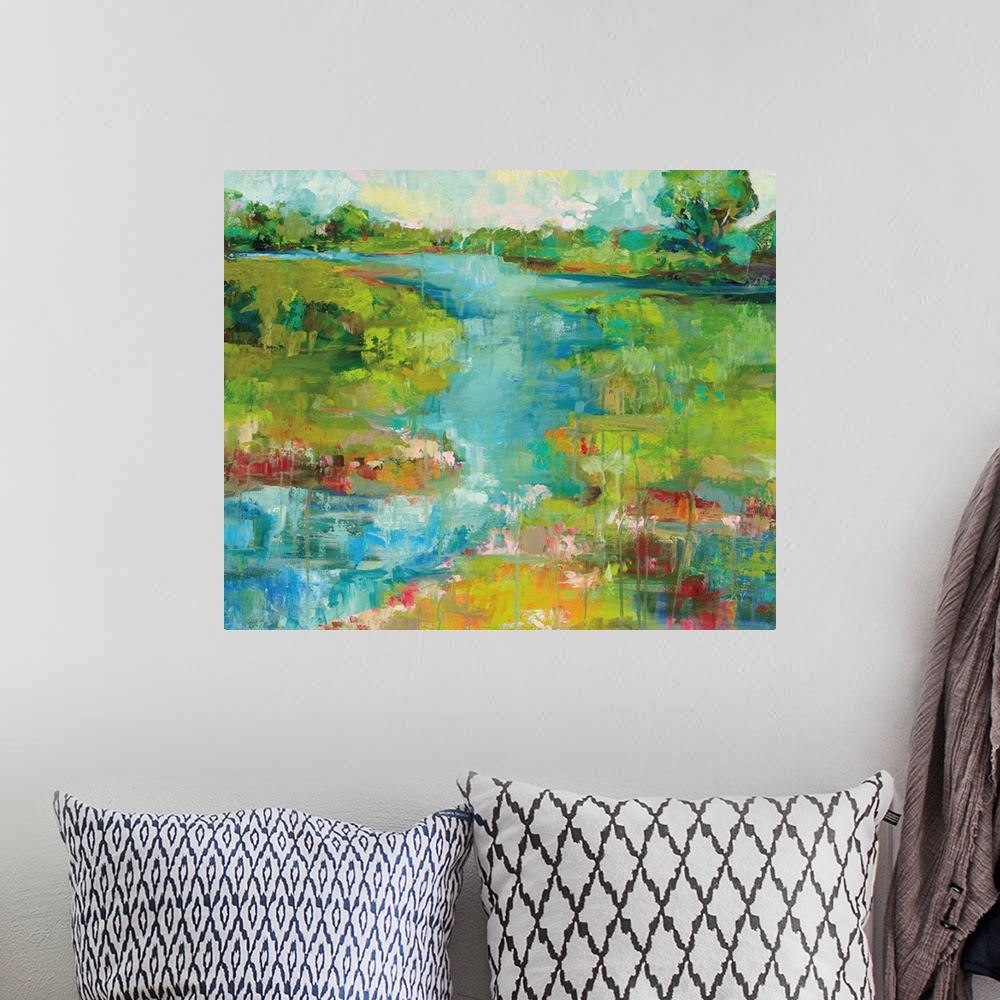 A bohemian room featuring Contemporary painting of a river running through a landscape.