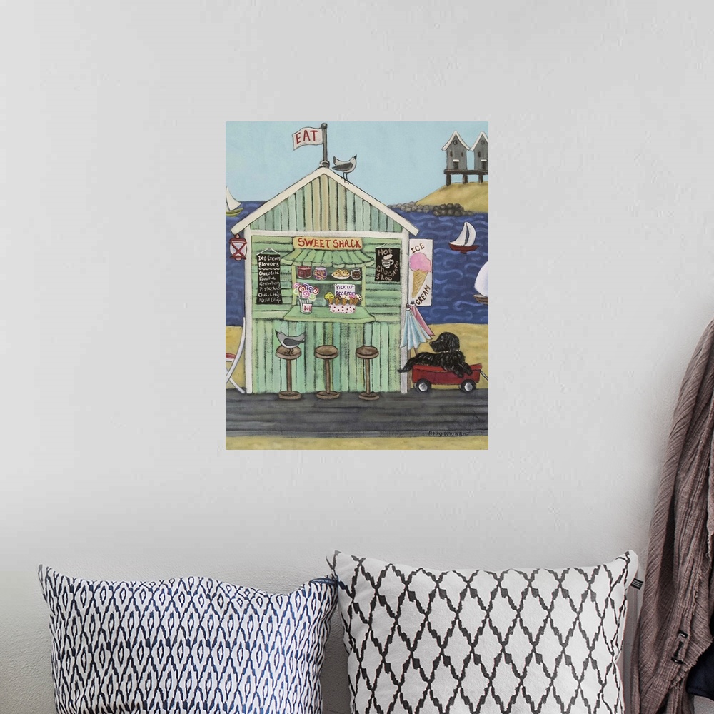 A bohemian room featuring Painting of a coastal environment with old beach town building.
