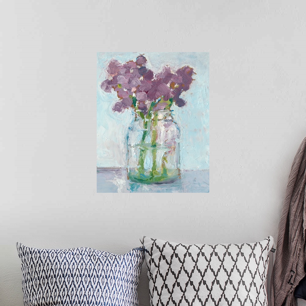 A bohemian room featuring Impressionist style art print of purple flowers in a glass vase.