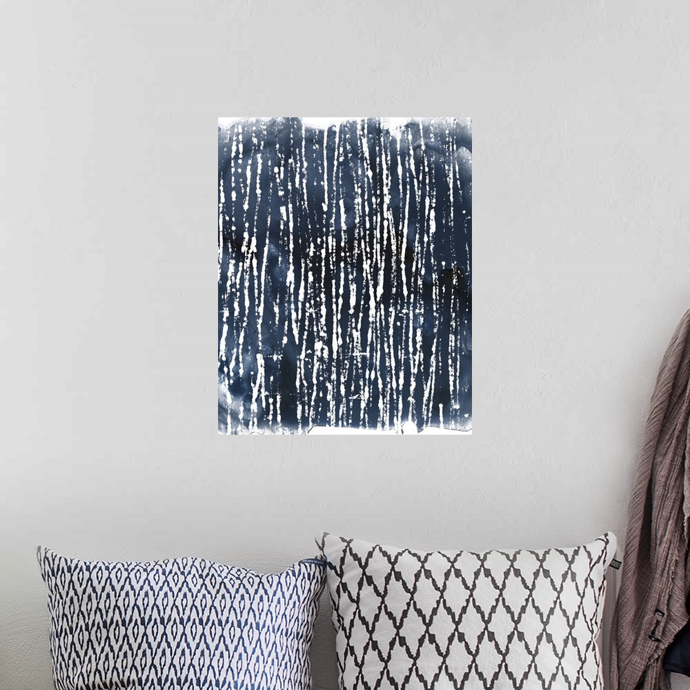 A bohemian room featuring Decorative abstract artwork with a design in indigo and white.
