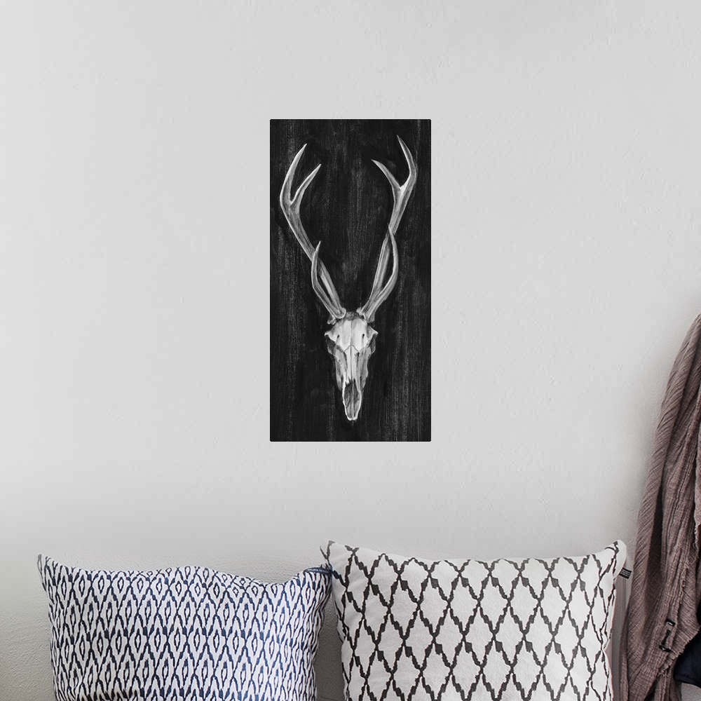 A bohemian room featuring Contemporary artwork of an antelope skull with large horns.