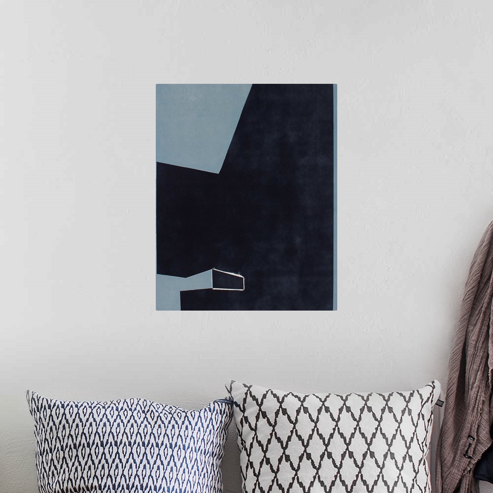 A bohemian room featuring Minimalist artwork comprised of black polygonal shapes on a blue gray background.