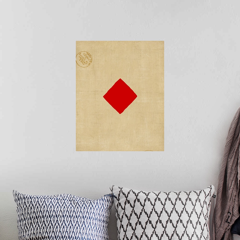 A bohemian room featuring Contemporary artwork resembling a giant playing card with two stamp emblems.