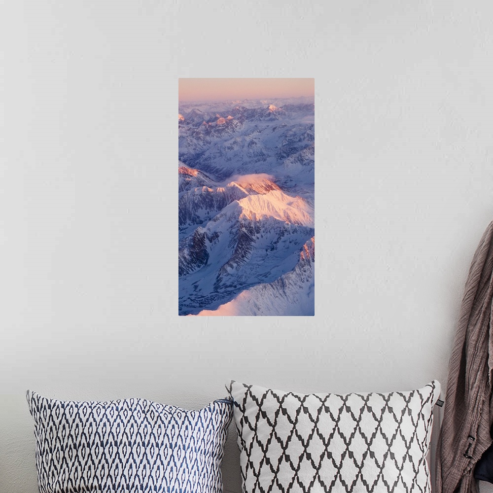 A bohemian room featuring Aerial view of the Chugach Mountain range with sunrise alpenglow hitting the peaks during Winter ...