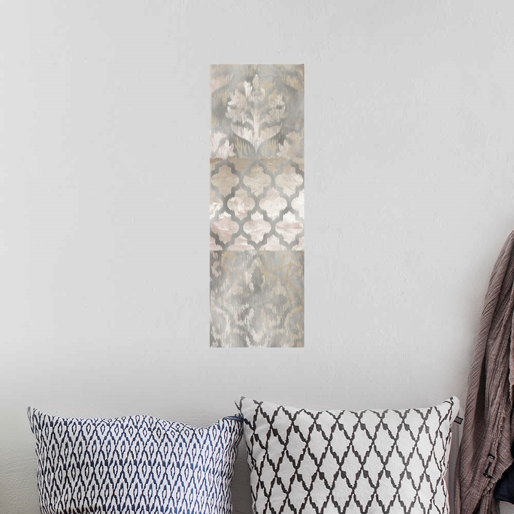 A bohemian room featuring Large panel decor with brown, silver, white, and gold colored ikat patterns.