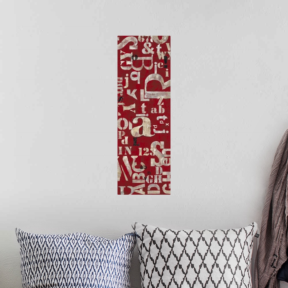 A bohemian room featuring Contemporary home decor artwork using letters against a deep red background.