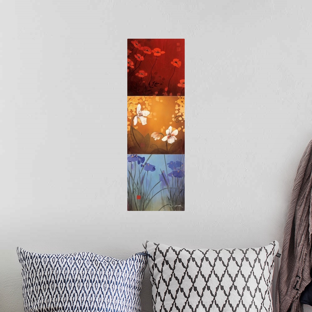 A bohemian room featuring A long vertical painting of flowers in three panels of red, yellow and blue.