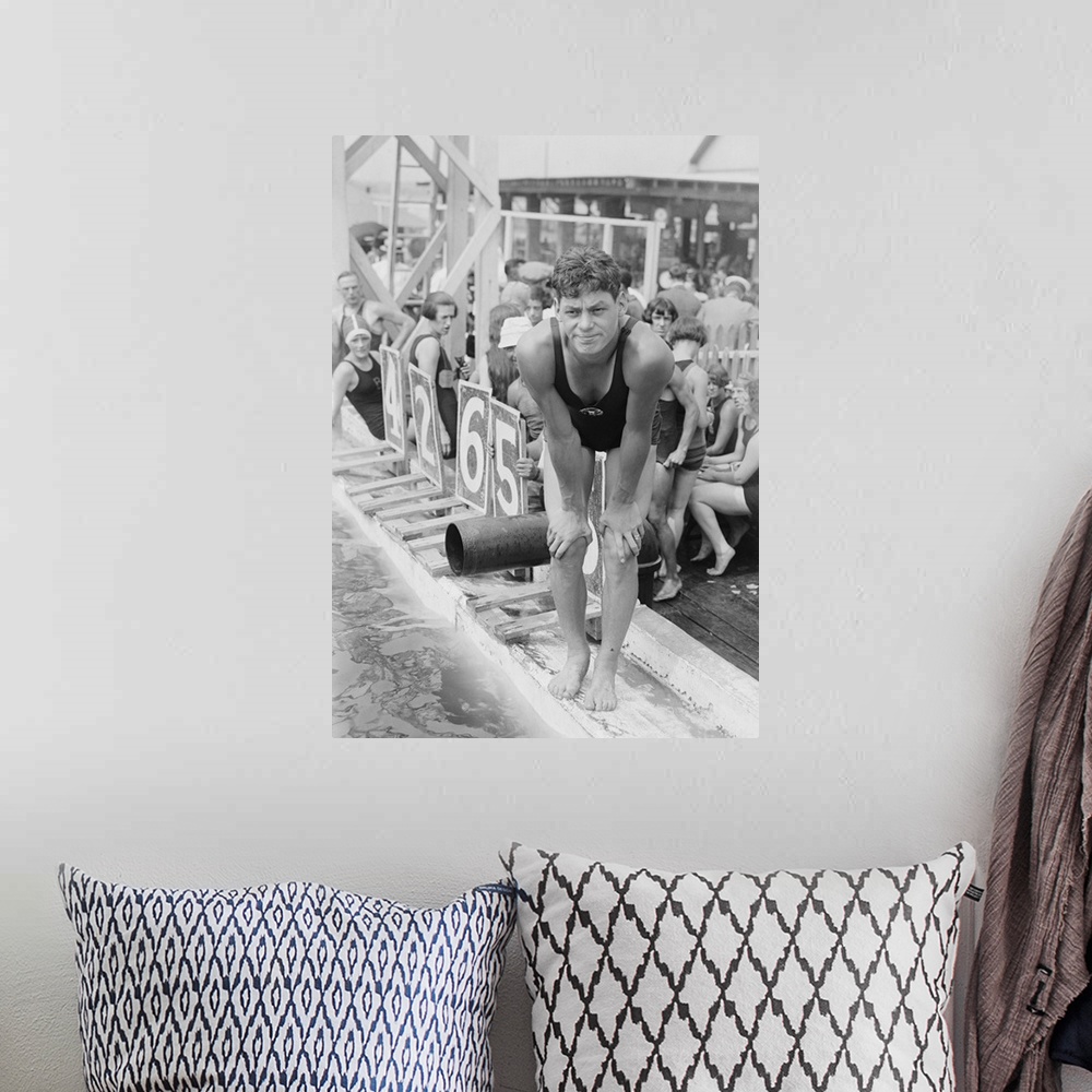 A bohemian room featuring Johnny Weissmuller at competitive swimming event in the 1920s. After winning five Olympic gold me...