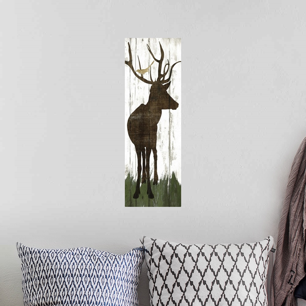 A bohemian room featuring Silhouette of a deer with birds in its antlers on a wooden board background.