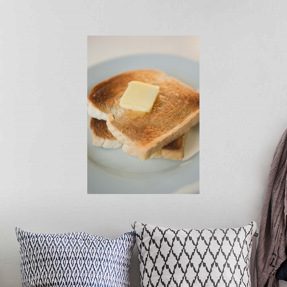 A bohemian room featuring Close up of toasts with butter on plate