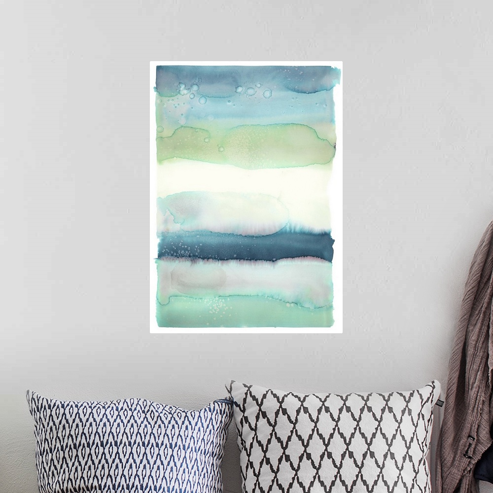 A bohemian room featuring Blue, green, and white watercolor painting in horizontal layers.