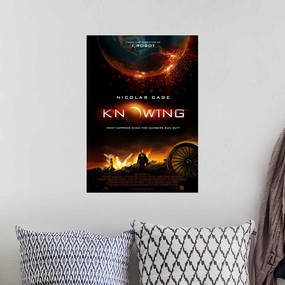 A bohemian room featuring Knowing - Movie Poster