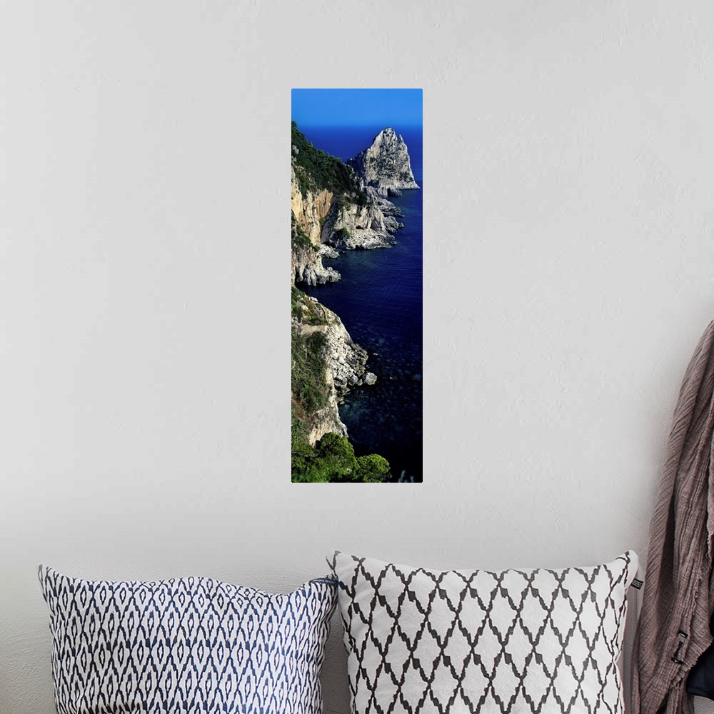 A bohemian room featuring High angle view of rock formations on the coast, Faraglioni, Capri, Italy