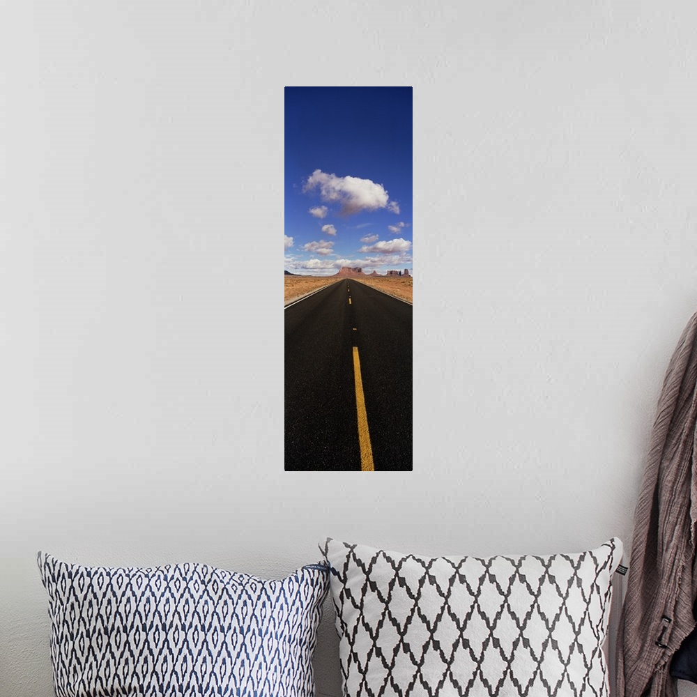 A bohemian room featuring Road shot w/ clouds Monument Valley  AZ