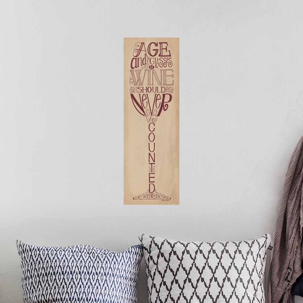 A bohemian room featuring Handlettered home decor art with dark red lettering against a distressed brown background.
