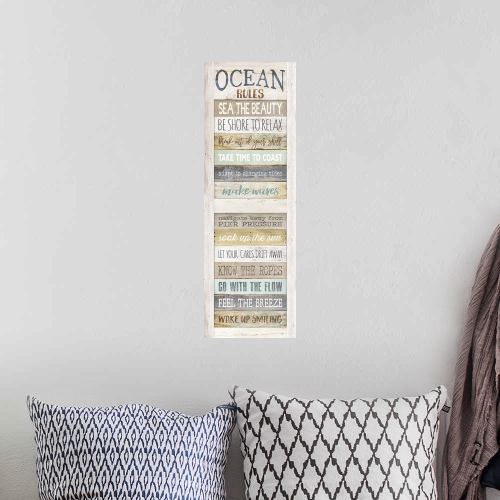 A bohemian room featuring List of rules for enjoying the seaside painted on a wooden board background.