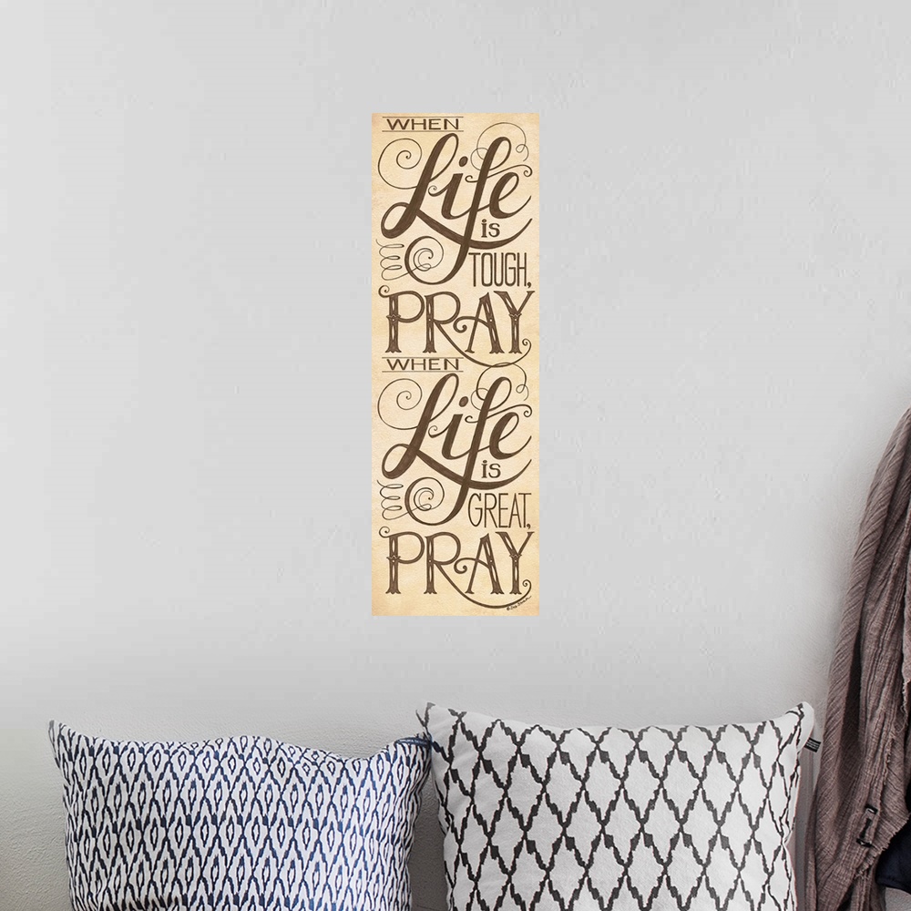A bohemian room featuring Handlettered home decor art with black  lettering against a distressed brown background.