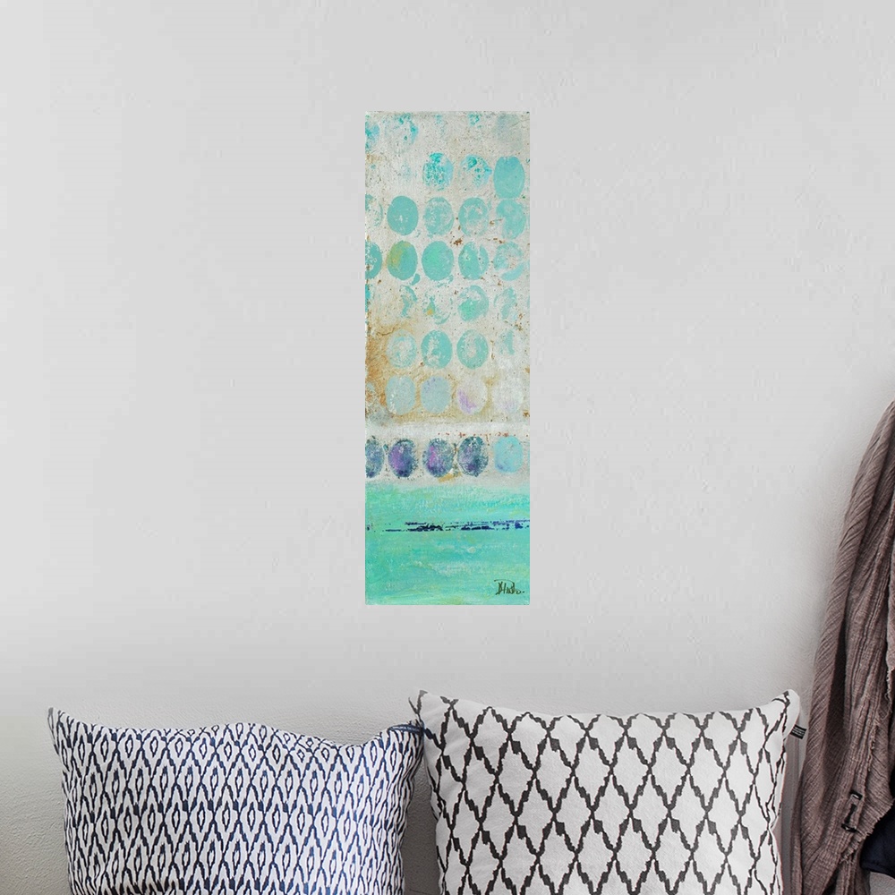 A bohemian room featuring Painting of a turquoise dots against a beige background.