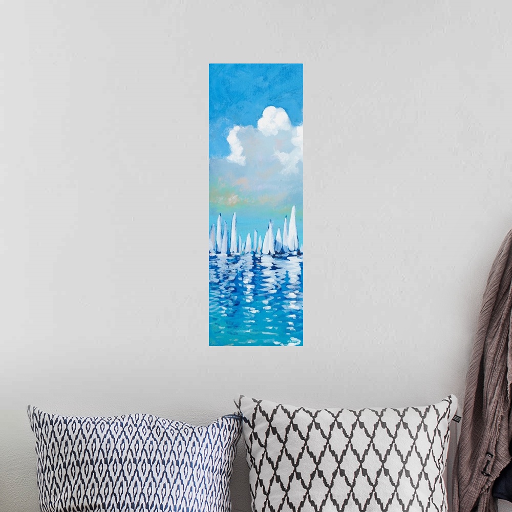 A bohemian room featuring Vertical artwork of a group of white sailboats against a blue sky.