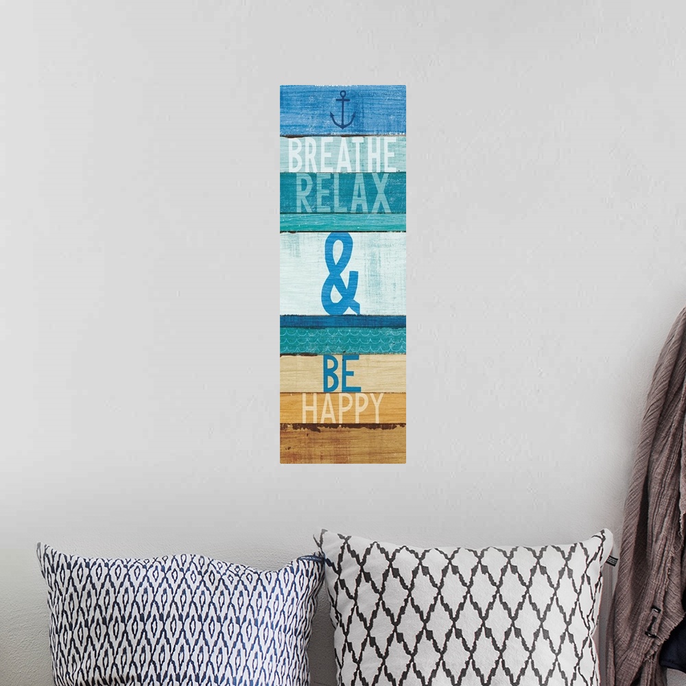 A bohemian room featuring "Breathe Relax and Be Happy" written on blue and tan rectangular shaped stained wood pieces.