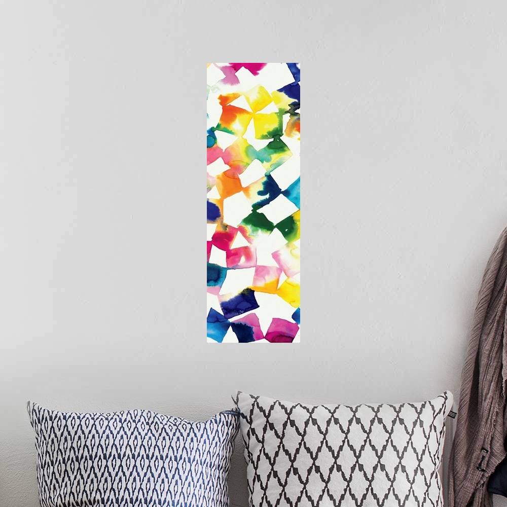 A bohemian room featuring Colorful abstract artwork of square shapes in bright rainbow colors.