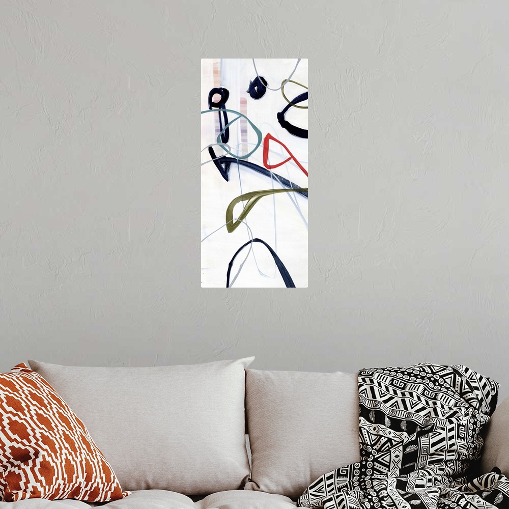 A bohemian room featuring A contemporary abstract painting of colorful bold lines hovering in an off-white space.