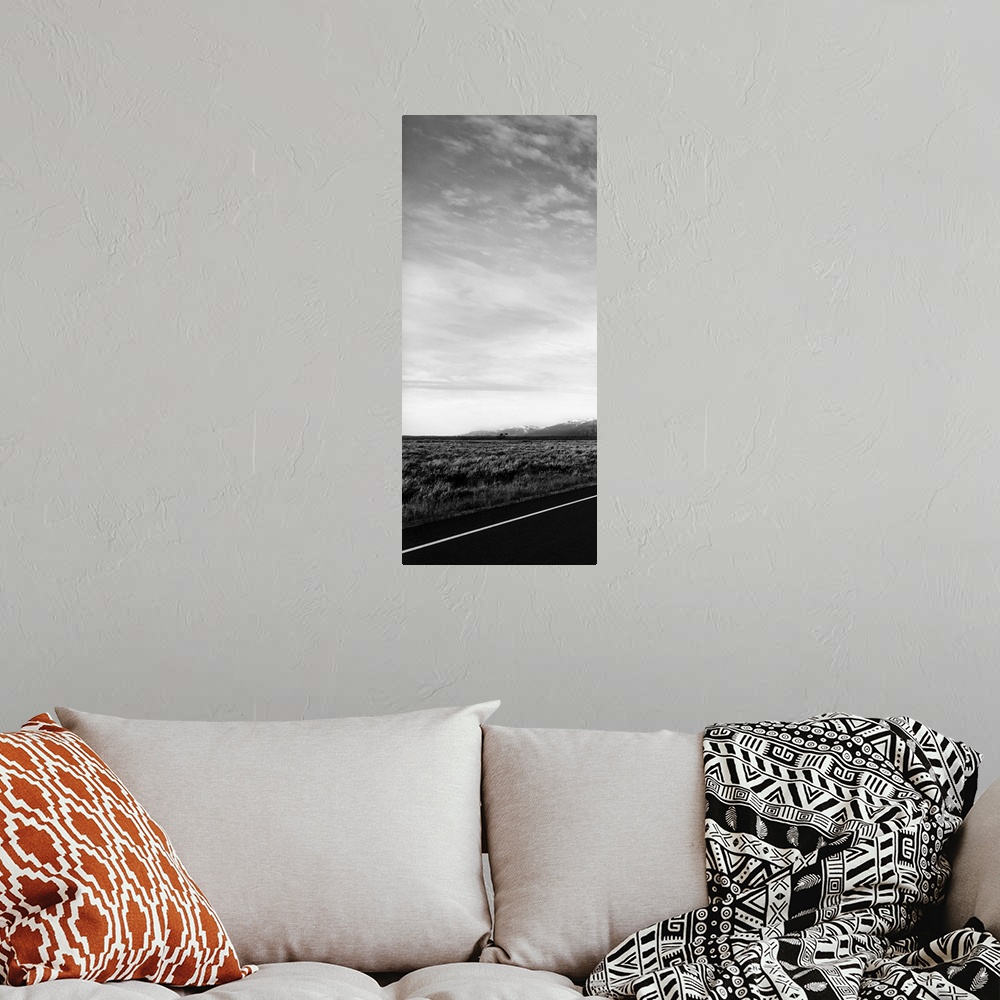 A bohemian room featuring One photo in a series of three taken on  a road to Grand Teton.