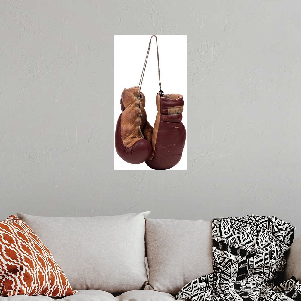 A bohemian room featuring A pair of brown leather boxing gloves