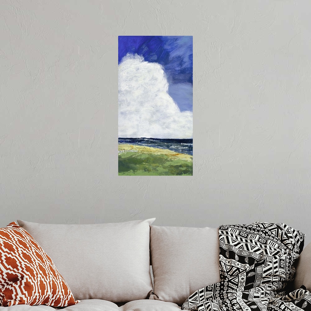 A bohemian room featuring Contemporary landscape painting of a green field leading to a cliff out to sea with giant clouds ...