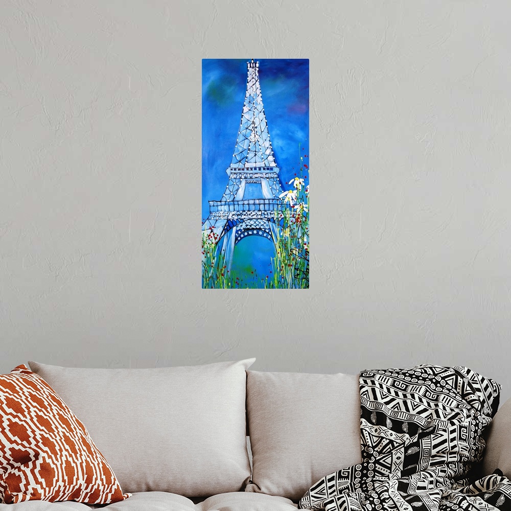 A bohemian room featuring Watercolor painting of the Eiffel Tower, framed by flowers.